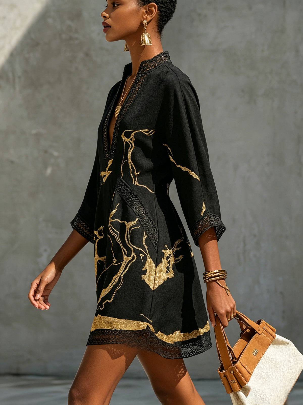 LEON | VESTIDO MINI DE ENCAJE NEGRO Y DORADO